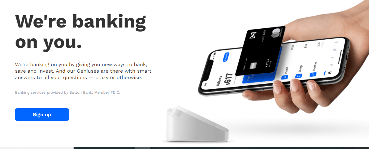 Text "We`re banking on you" and smartphone on the whiteboard